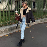 Veste longue en fourrure à multiples zips